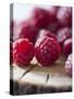 Raspberries on a Wooden Surface-Martina Schindler-Stretched Canvas
