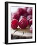 Raspberries on a Wooden Surface-Martina Schindler-Framed Photographic Print