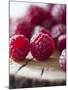 Raspberries on a Wooden Surface-Martina Schindler-Mounted Photographic Print