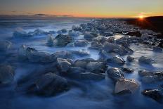 Pieces of glacial ice over black sand being washed by waves, Iceland-Raul Touzon-Laminated Photographic Print