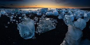 Pieces of glacial ice over black sand being washed by waves, Iceland-Raul Touzon-Mounted Photographic Print