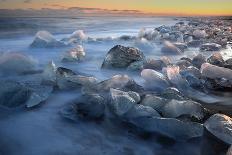 Pieces of glacial ice over black sand being washed by waves, Iceland-Raul Touzon-Framed Photographic Print