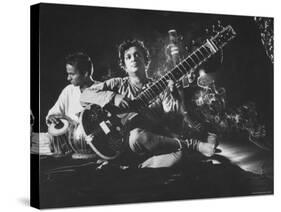 Ravi Shankar Passionately Playing the Sitar-Paul Schutzer-Stretched Canvas