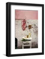 Raw Pork Ribs Hanging on the Wall of a House, Next to a A Gold-Framed Picture-Maria Brinkop-Framed Photographic Print