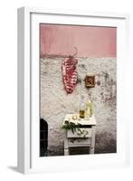 Raw Pork Ribs Hanging on the Wall of a House, Next to a A Gold-Framed Picture-Maria Brinkop-Framed Photographic Print