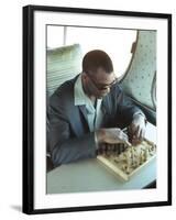 Ray Charles Playing Chess on the Tour Bus-null-Framed Photo