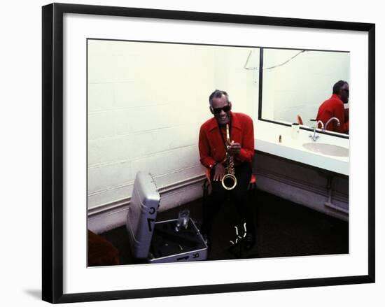 Ray Charles with His Alto Saxophone Backstage-null-Framed Photo