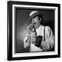 Raymond Devos Eating a Candy-Thérese Begoin-Framed Photographic Print