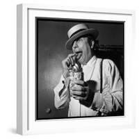 Raymond Devos Eating a Candy-Thérese Begoin-Framed Photographic Print