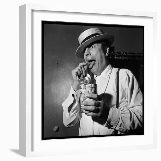 Raymond Devos Eating a Candy-Thérese Begoin-Framed Photographic Print