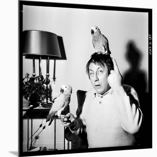 Raymond Devos with Two Parrots in Colmar, August 3968-Marcel Begoin-Mounted Photographic Print