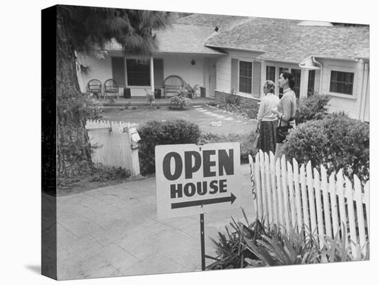 Realtor Pat Devault Showing a House to Her Clients-J^ R^ Eyerman-Stretched Canvas