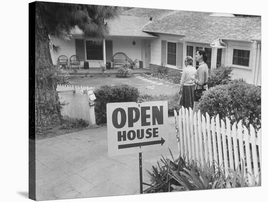 Realtor Pat Devault Showing a House to Her Clients-J^ R^ Eyerman-Stretched Canvas