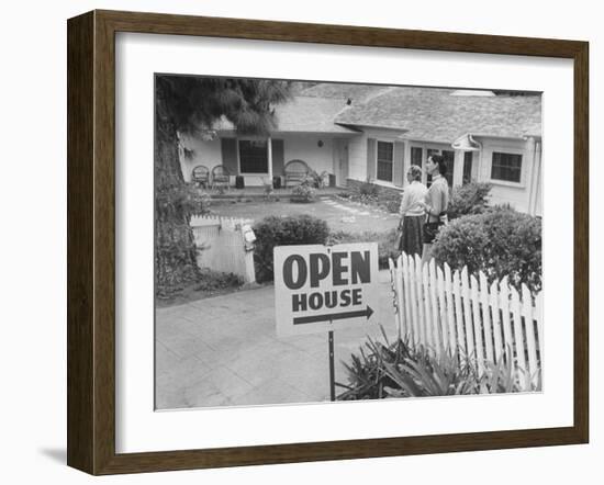 Realtor Pat Devault Showing a House to Her Clients-J^ R^ Eyerman-Framed Photographic Print