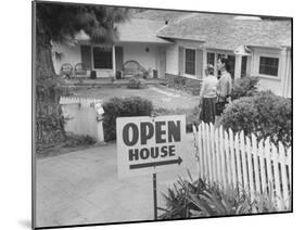 Realtor Pat Devault Showing a House to Her Clients-J^ R^ Eyerman-Mounted Photographic Print