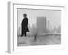 Realtor William J. Zeckendorf, Standing in the Wind Fields Located on the Outskirts of the City-John Loengard-Framed Premium Photographic Print