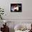 Rear View of a Boxer Punching a Punching Bag-null-Framed Photographic Print displayed on a wall