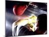 Rear View of a Boxer Punching a Punching Bag-null-Mounted Photographic Print