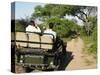 Rear View of a Group of Tourists in Jeep Looking at Elephant-Nosnibor137-Stretched Canvas