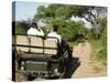 Rear View of a Group of Tourists in Jeep Looking at Elephant-Nosnibor137-Stretched Canvas