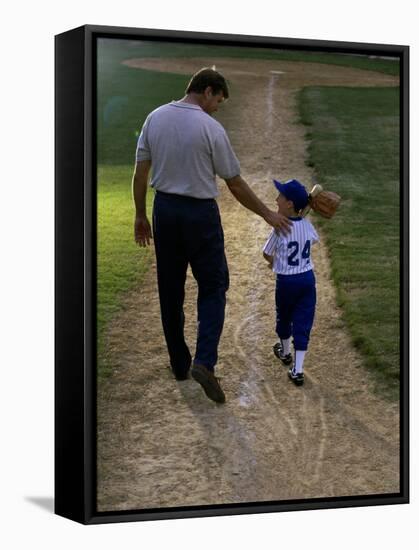 Rear View of a Man Walking with His Son at a Playing Field-null-Framed Stretched Canvas