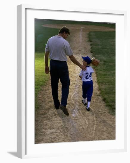 Rear View of a Man Walking with His Son at a Playing Field-null-Framed Photographic Print