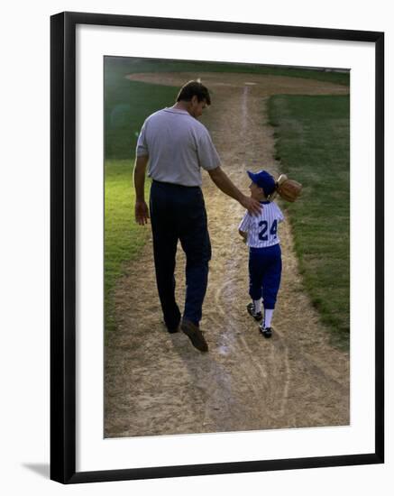 Rear View of a Man Walking with His Son at a Playing Field-null-Framed Photographic Print