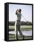 Rear View of a Senior Man Swinging a Golf Club-null-Framed Stretched Canvas