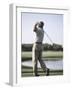 Rear View of a Senior Man Swinging a Golf Club-null-Framed Photographic Print