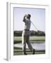 Rear View of a Senior Man Swinging a Golf Club-null-Framed Photographic Print