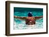 Rear view of a woman swimming the butterfly stroke in a swimming pool, Bainbridge Island, Washin...-Pete Saloutos-Framed Photographic Print