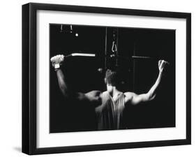 Rear View of a Young Man Exercise on a Lateral Pull-Down Weight Machine-null-Framed Premium Photographic Print
