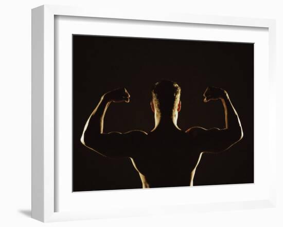 Rear View of a Young Man Flexing His Muscles-null-Framed Photographic Print