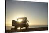 Rear View of Young Couple in Pick-Up Truck Parked in Front of Ocean Enjoying Sunset-Nosnibor137-Stretched Canvas