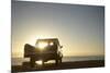 Rear View of Young Couple in Pick-Up Truck Parked in Front of Ocean Enjoying Sunset-Nosnibor137-Mounted Photographic Print