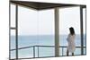 Rear View of Young Woman Looking at Ocean View from Balcony at Resort-Nosnibor137-Mounted Photographic Print
