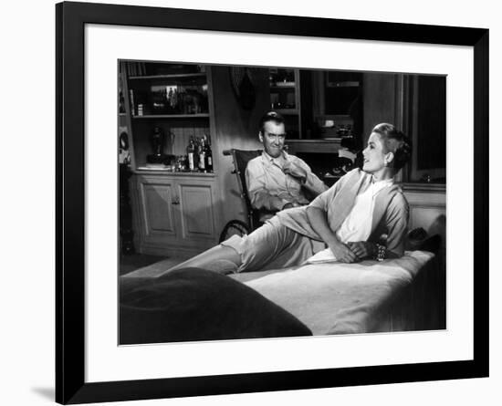 REAR WINDOW, 1954 directed byALFRED HITCHCOCK James Stewart and Grace Kelly (b/w photo)-null-Framed Photo