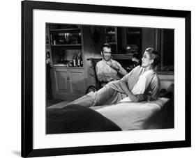 REAR WINDOW, 1954 directed byALFRED HITCHCOCK James Stewart and Grace Kelly (b/w photo)-null-Framed Photo