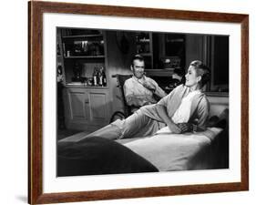 REAR WINDOW, 1954 directed byALFRED HITCHCOCK James Stewart and Grace Kelly (b/w photo)-null-Framed Photo