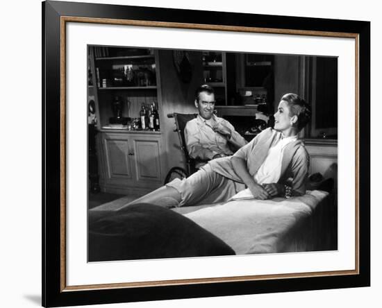 REAR WINDOW, 1954 directed byALFRED HITCHCOCK James Stewart and Grace Kelly (b/w photo)-null-Framed Photo