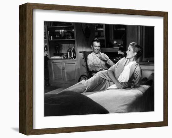 REAR WINDOW, 1954 directed byALFRED HITCHCOCK James Stewart and Grace Kelly (b/w photo)-null-Framed Photo