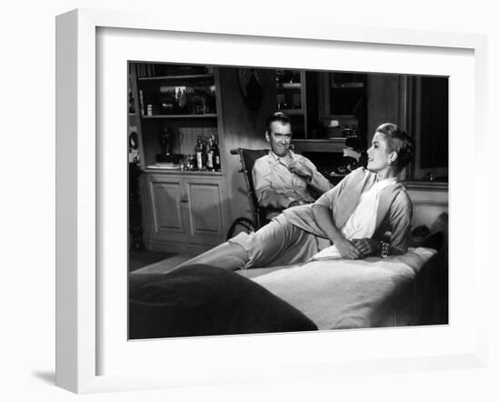 REAR WINDOW, 1954 directed byALFRED HITCHCOCK James Stewart and Grace Kelly (b/w photo)-null-Framed Photo