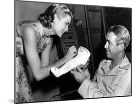 REAR WINDOW, 1954 directed byALFRED HITCHCOCK On the set, Grace Kelly and James Stewart (b/w photo)-null-Mounted Photo