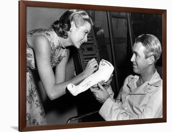 REAR WINDOW, 1954 directed byALFRED HITCHCOCK On the set, Grace Kelly and James Stewart (b/w photo)-null-Framed Photo