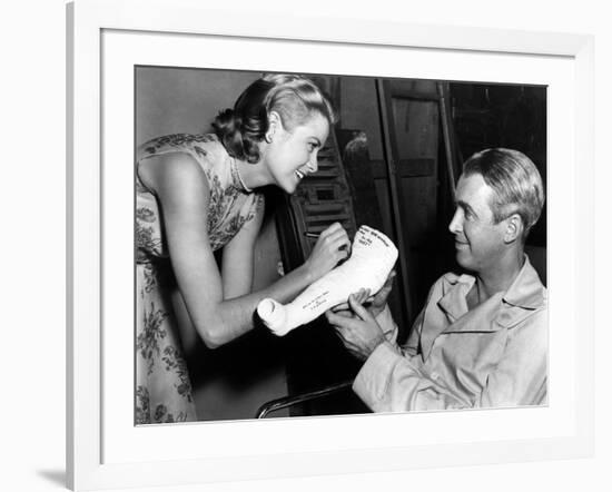 REAR WINDOW, 1954 directed byALFRED HITCHCOCK On the set, Grace Kelly and James Stewart (b/w photo)-null-Framed Photo