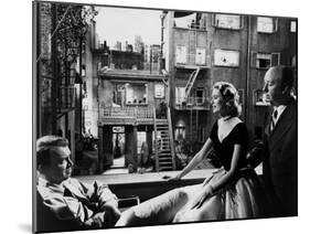 REAR WINDOW, 1954 directed byALFRED HITCHCOCK On the set, Grace Kelly between James Stewart and Alf-null-Mounted Photo