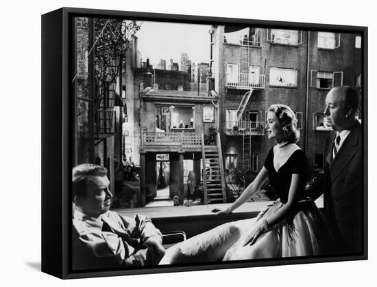 REAR WINDOW, 1954 directed byALFRED HITCHCOCK On the set, Grace Kelly between James Stewart and Alf-null-Framed Stretched Canvas