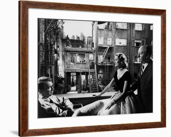 REAR WINDOW, 1954 directed byALFRED HITCHCOCK On the set, Grace Kelly between James Stewart and Alf-null-Framed Photo