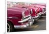 Red and pink vintage American car taxis on street in Havana, Cuba, West Indies, Central America-Ed Hasler-Framed Photographic Print