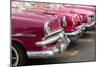 Red and pink vintage American car taxis on street in Havana, Cuba, West Indies, Central America-Ed Hasler-Mounted Photographic Print